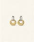 Pair of gold and silver hoop earrings on a light beige background